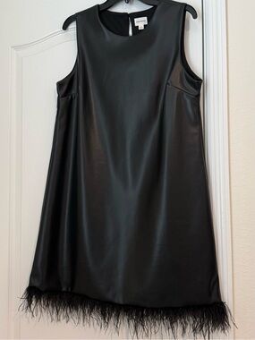FORCYNTHIA sleeveless black faux leather mini shift dress with feather hem.